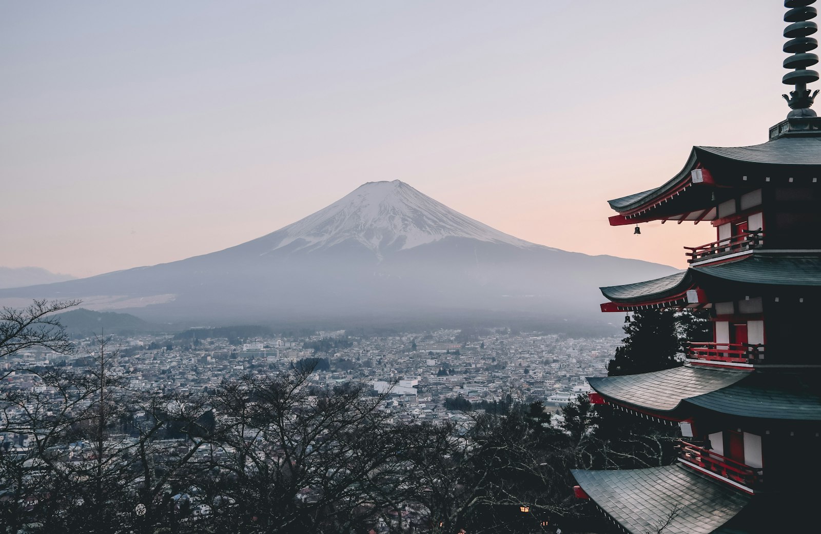 Mount Fuji rising over the city at dawn